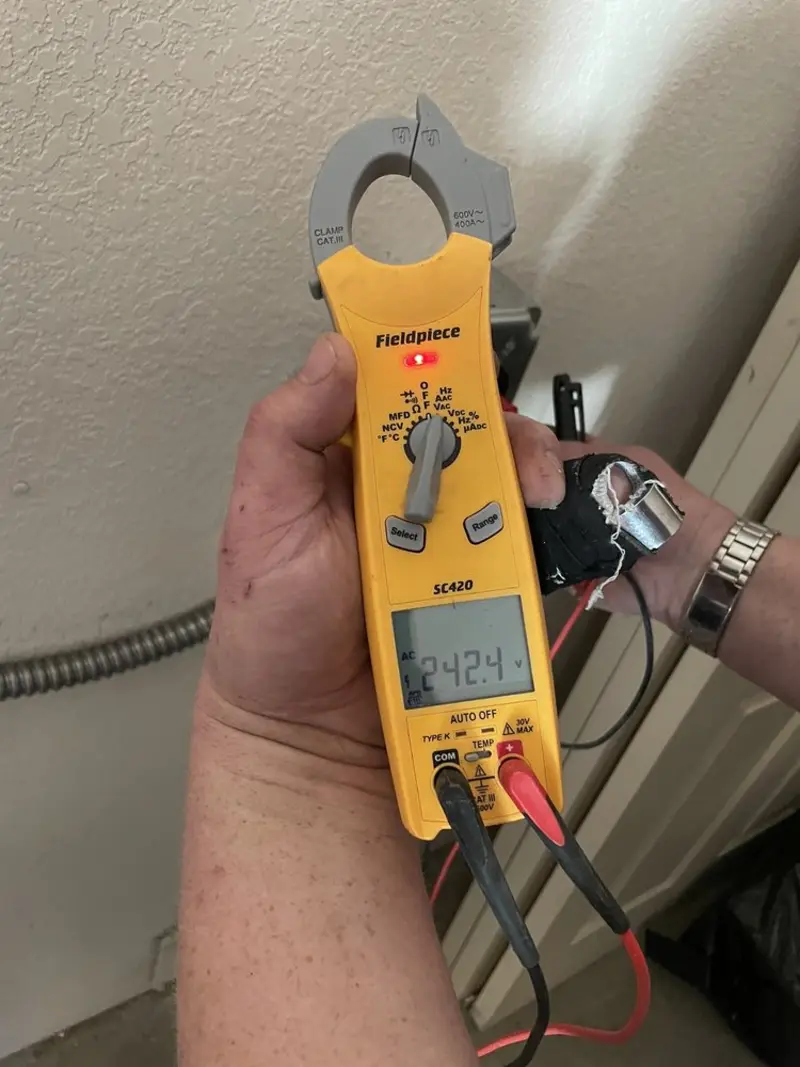 Voltage testing with clamp meter during Recessed Lighting Installation in Fair Lakes